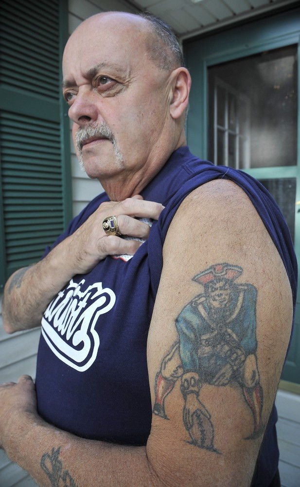 Forget bumper stickers, some Patriots fans express their loyalty to the team through tattoos